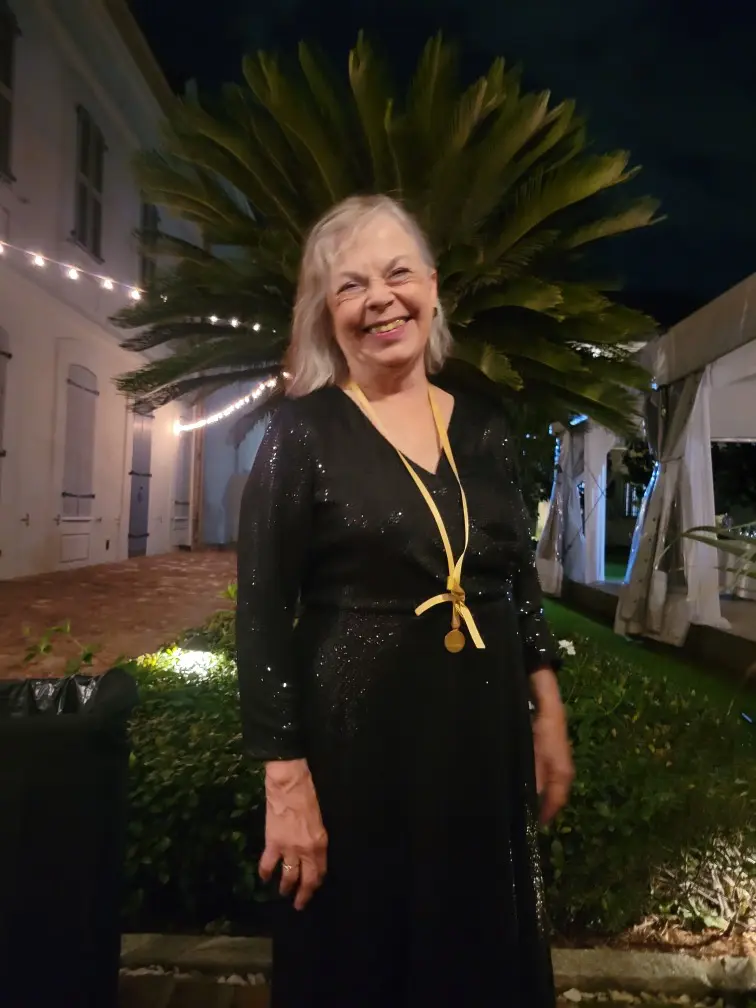 Poet and novelist Patricia Barone in a black dress outside the Faulkner Awards